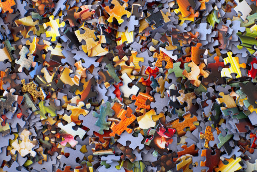 A Pile Of Puzzle Pieces Put On By Apprise Wealth Management
