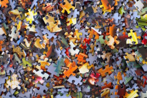 A Pile Of Puzzle Pieces + Overlooked part of Investing, Put On By Apprise Wealth Management