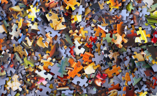 A Pile Of Puzzle Pieces + Overlooked part of Investing, Put On By Apprise Wealth Management