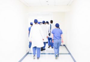 Doctors and Nurses at a Hospital and Top Financial Mistakes Doctors Make