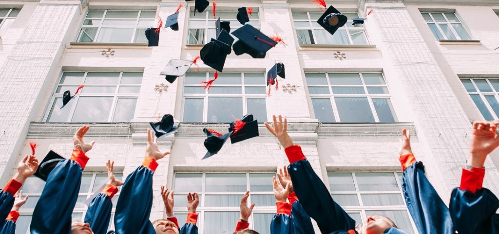 College Graduates Throwing Cap in the Air