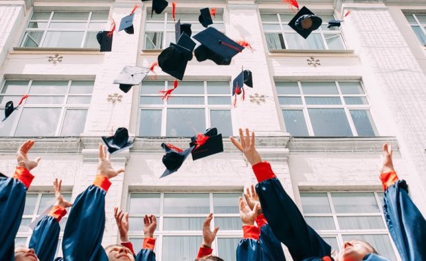 College Graduates Throwing Cap in the Air