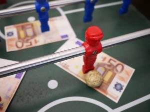 Money on Foosball Table an Example of Sports Bettors