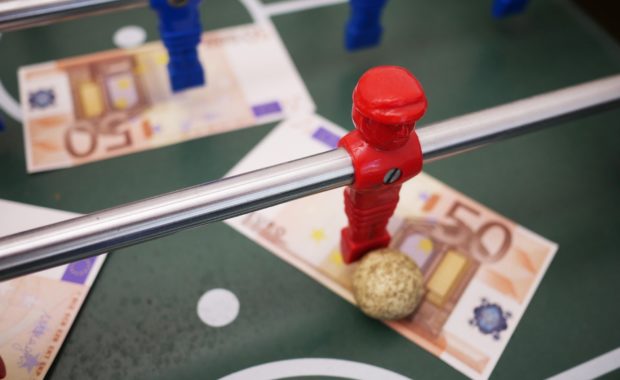 Money on Foosball Table an Example of Sports Bettors