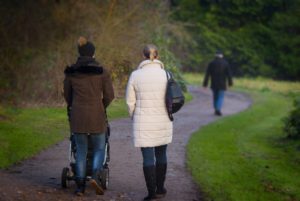 Family Walking a Trail and How to Manage Finances as a Family