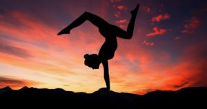 Women Doing Yoga During Sunset