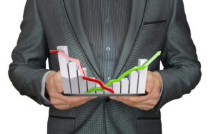 A Man In A Suit Holding Graph Chart Of Stock Market and Five Favorite Reads for the Week of February 13, 2022