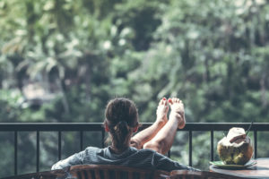 Retired Women Sitting Outside With a Coconut and Return on Life