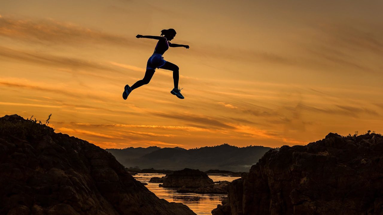 Women Jumping Over Rocky Hill and the Challenges Women Face